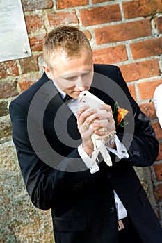 Groom releasing white dove