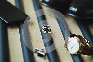 Groom's accessories: rings, watches cufflinks leather shoes.