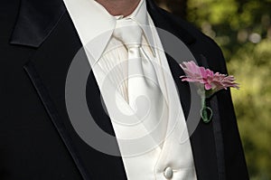 Groom's black tux and tie photo