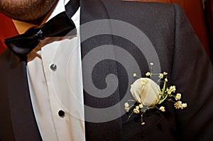 Groom's white pocket flower