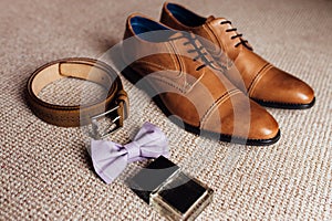 Groom set clothes. Wedding shoes, bow tie, phone