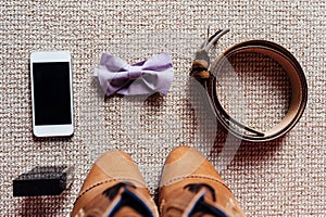 Groom set clothes. Wedding shoes, bow tie, phone