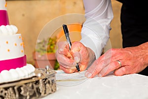 Groom Signing Marriage Certificate