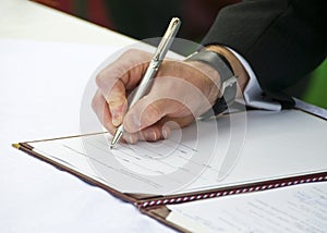 Groom Signing Wedding Regester 2