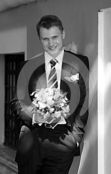 Groom stood with bouquet