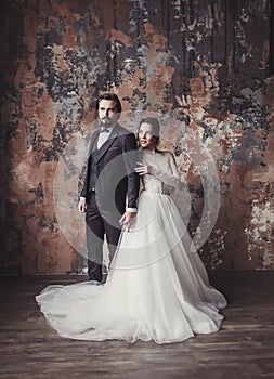 Groom in a suit and the bride in a wedding dress