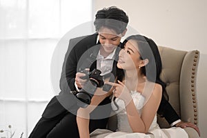 Groom taking pictures of beautiful bride for wedding ceremony, Love ,Romantic and wedding proposal concept