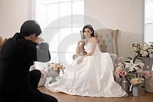 Groom taking pictures of beautiful bride for wedding ceremony, Love ,Romantic and wedding proposal concept