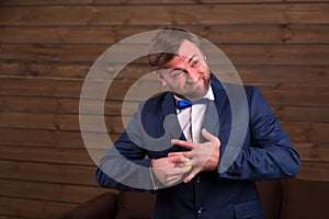 Groom trying to put on a wedding ring on finger