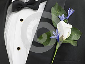 Groom Wearing A Suit With A Rose Corsage