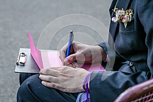 A groom writing a note to his bride.