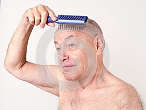 Daily Grooming Bald Man Brushing Scalp