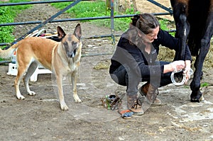 Grooming her horse