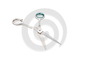 Grooming scissors. Scissors for cutting hair for people and pets. Open scissors on a white isolated background. Close-up