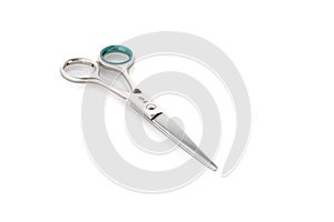 Grooming scissors. Scissors for cutting people and pets. Closed scissors on a white isolated background. Close-up