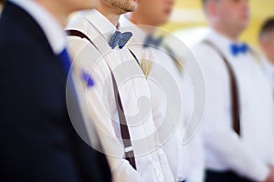 Groomsmen during catholic wedding ceremony