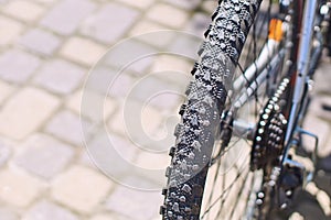 Grooved tire on a mountain bike wheel on a sunny day