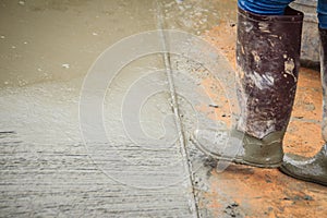 Grooving on concrete pavement by worker used deformed steel bar