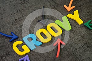 Groovy modern programming language for software development or application concept, multi color arrows pointing to the word Groovy