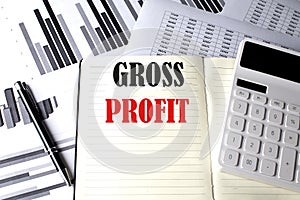 GROSS PROFIT text written on a notebook on chart and diagram