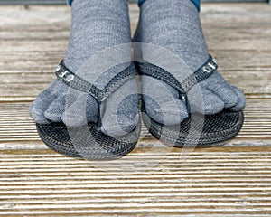 Gross - wearing toe socks in flip flops or jandals photo