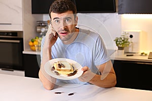 Grossed out man finding cockroaches on his sandwich photo