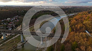 Grosshesseloher Brucke on Isar River in Munich, Germany aerial view. Two-story railroad and pedestrian bridge in Munchen