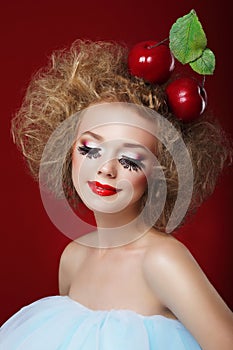 Grotesque. Humorous Woman with Red Apples and Fancy Makeup