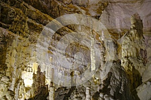 Grotta di Frasassi, Genga, Italy. inside one of the most extensive caves in Italy. White Stalactites and stalagmites closeup
