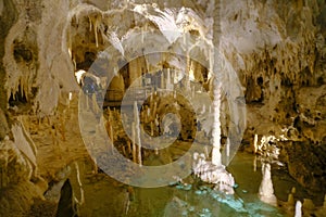 Grotta di Frasassi, Genga, Italy. Lake in the cave, Stalactites and stalagmites closeup