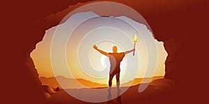 Concept of the invention of fire in prehistoric times with a man holding a torch, who stands with his arms raised in victory. photo
