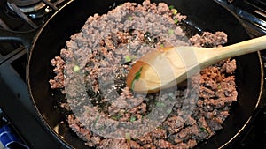 Ground Beef with Green Onion in Cast Iron Skillet
