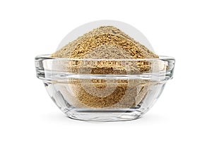 Ground black pepper in glass transparent bowl isolated on white background