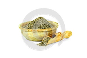 Ground black pepper in a wooden cup with a spoon for spices isolated on a white background. Collection of spices and