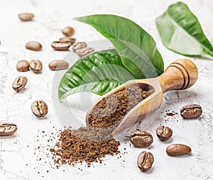 Ground coffee, beans and leaves