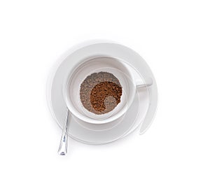 Ground coffee beans in white cup isolated