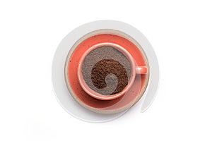 Ground coffee powder in cup isolated on a white background