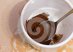 ground coffee in a white cup