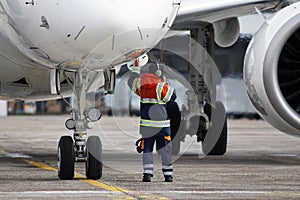 A ground control manager prepares for departing of aircraft