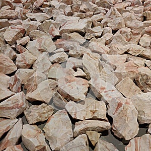 Ground covered with large pebbles for wallpaper.