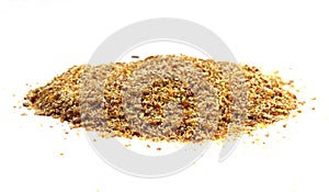 Ground or crushed brown flax seed or linseed isolated on white.