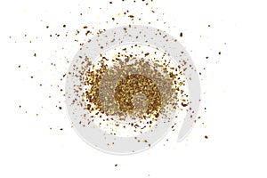 Ground or crushed brown flax seed or linseed isolated on white.