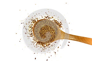 Ground or crushed brown flax seed or linseed isolated on white.
