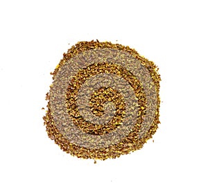 Ground or crushed brown flax seed or linseed isolated on white.