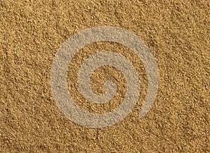 Ground cumin texture as background