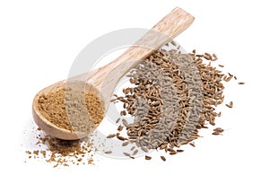 Ground cumin in a wooden spoon