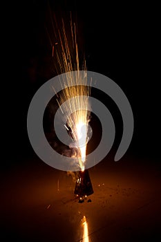 Ground firework with bright sparks