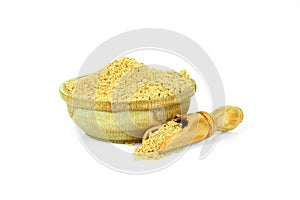 Ground ginger in a wooden cup with a spoon for spices isolated on a white background. Collection of spices and herbs