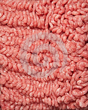 Ground hamburger meat on a white background