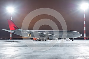 Ground handling of a passenger wide body aircraft on the airport apron in winter